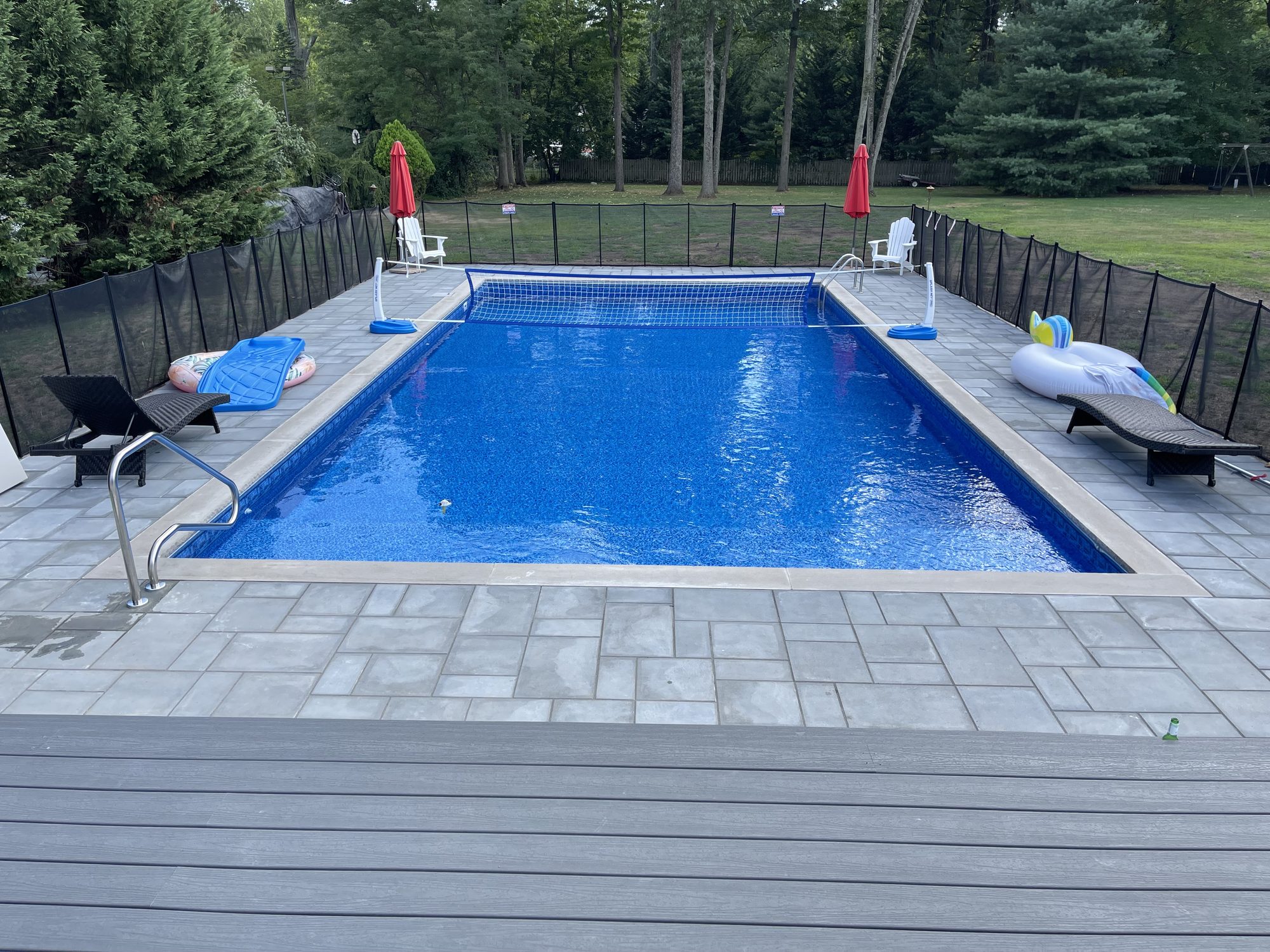Modern Rectangle Pool with Grey Paver Surround